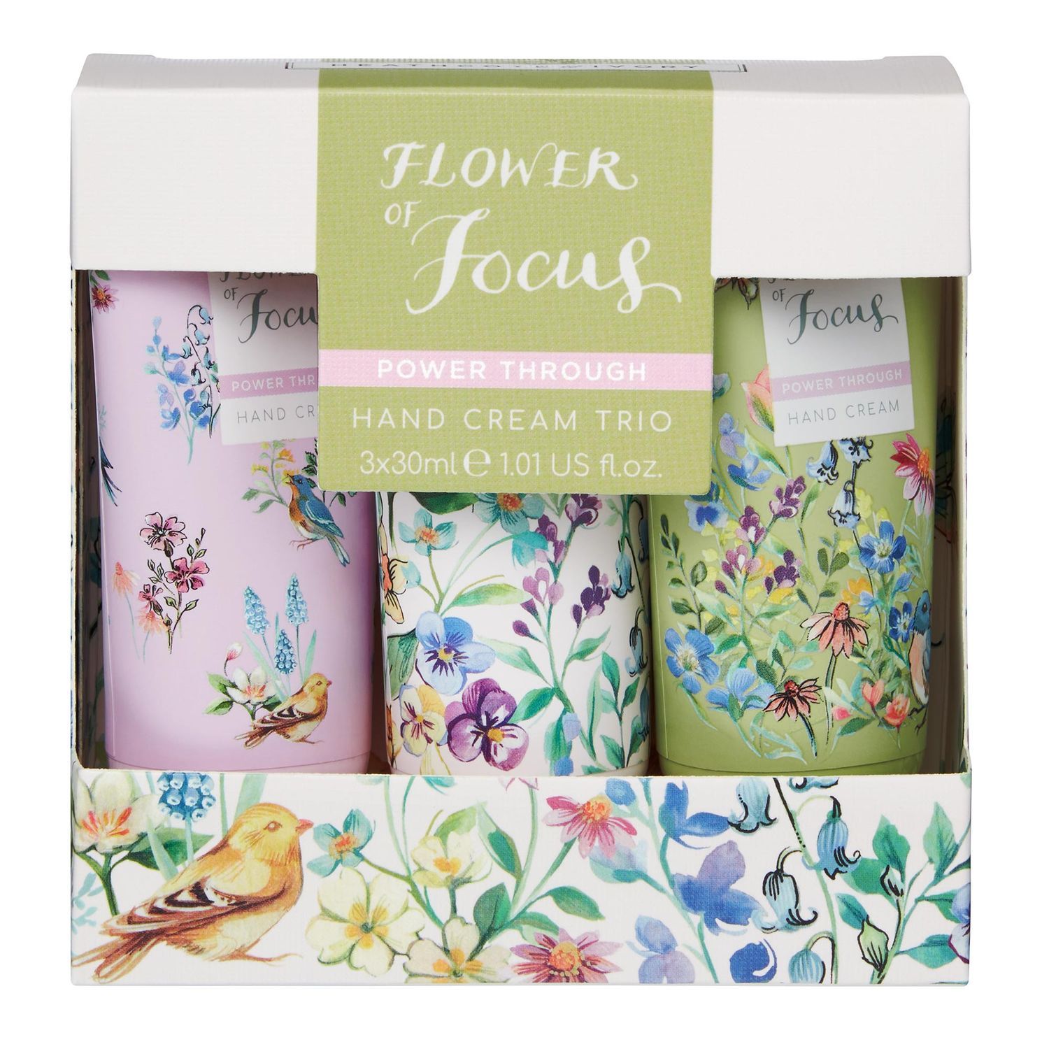 Handcreme-Trio in Schachtel. Drei Tuben mit floralem Design. Aufschrift: Flower of Focus, Hand Cream Trio.