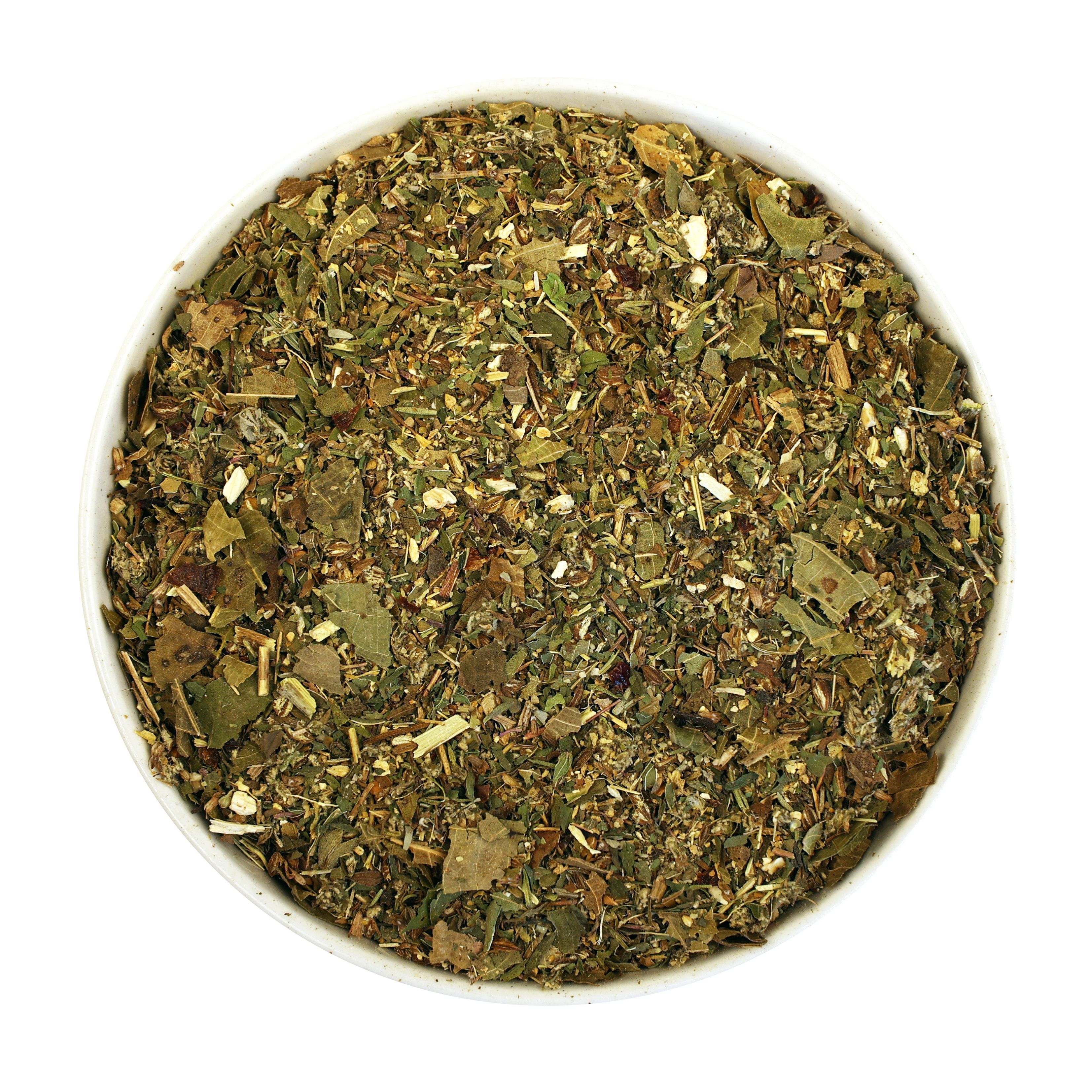 Kräutermischung in weißer Schale. Blätter, Stängel und Samen. Draufsicht.