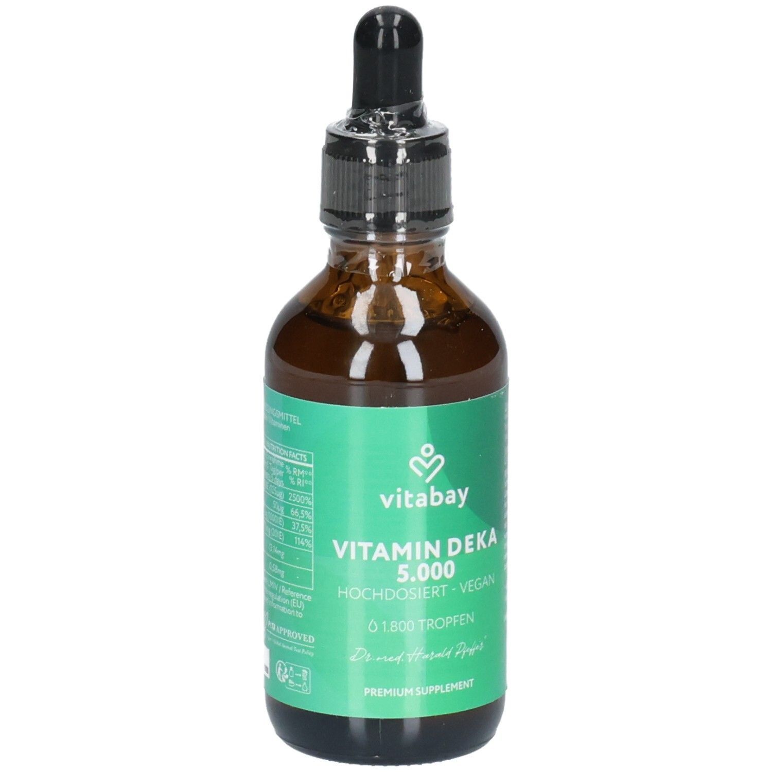 Braune Glasflasche mit Pipettenverschluss, gefüllt mit flüssigem Vitamin Deka 5.000. Grüne Banderole mit Produktinformationen.