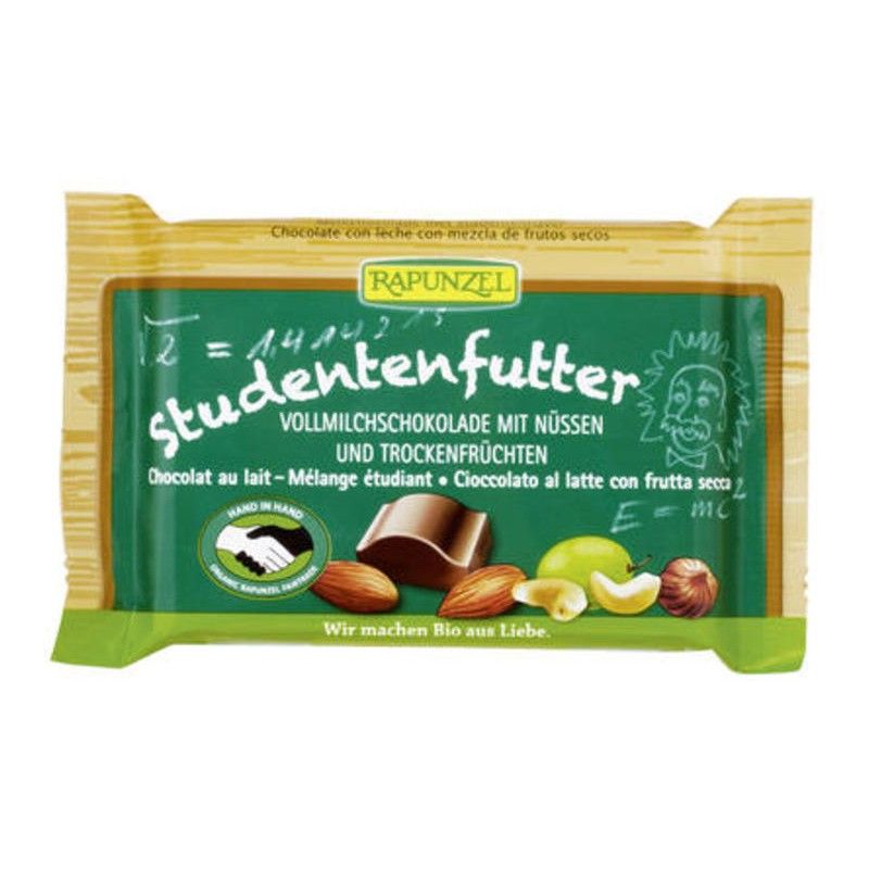 Verpackung von Rapunzel Studentenfutter Schokolade. Grün-braune Verpackung mit Produktnamen, Nüssen und Schokoladenstückchen.