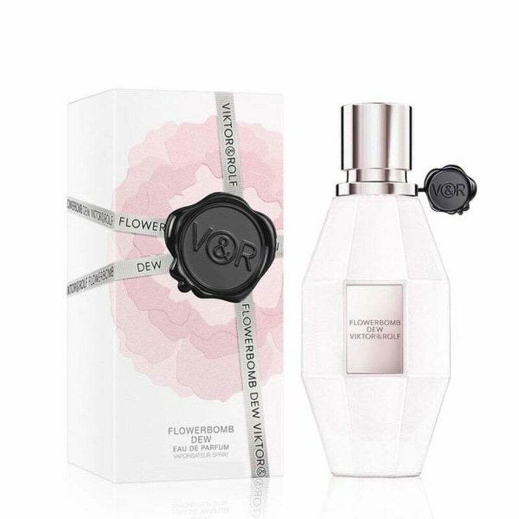 Parfümflasche und Schachtel. Flasche weiß, achteckig, mit silbernem Verschluss und schwarzem Verschluss. Schachtel weiß mit rosa Blüte und Text.