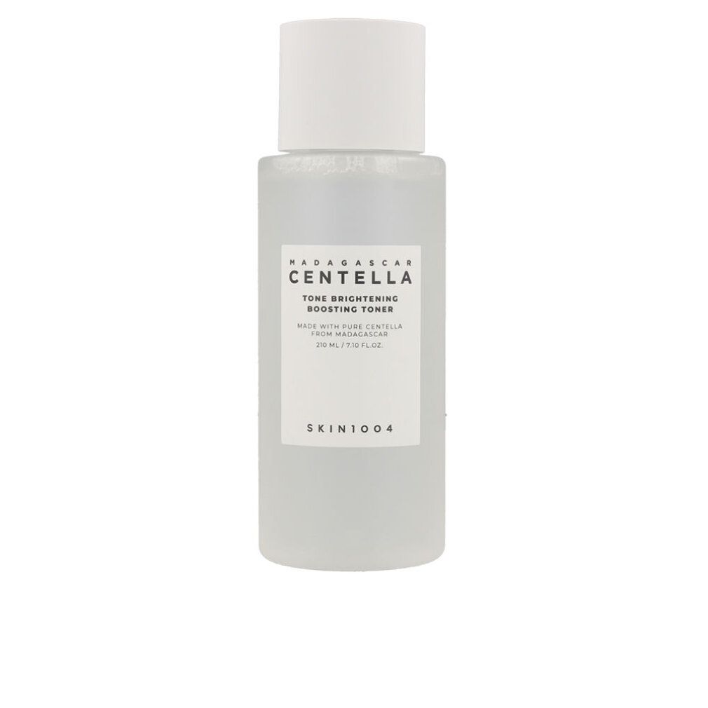 Madagaskar Centella Tone Brightening Boosting Toner in matter Glasflasche mit weißem Deckel, umgeben von Steinen.