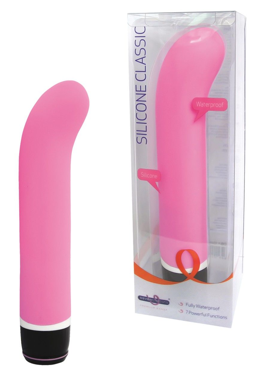 Rosa Vibrator. In Verpackung mit Aufschrift SILICONE CLASSIC. Wasserdicht. 7 Funktionen.