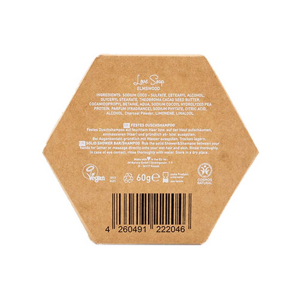 Seife in sechseckiger Verpackung. Rückseite mit Inhaltsstoffen, Barcode und Vegan-Siegel. Text: Festes Duschshampoo.