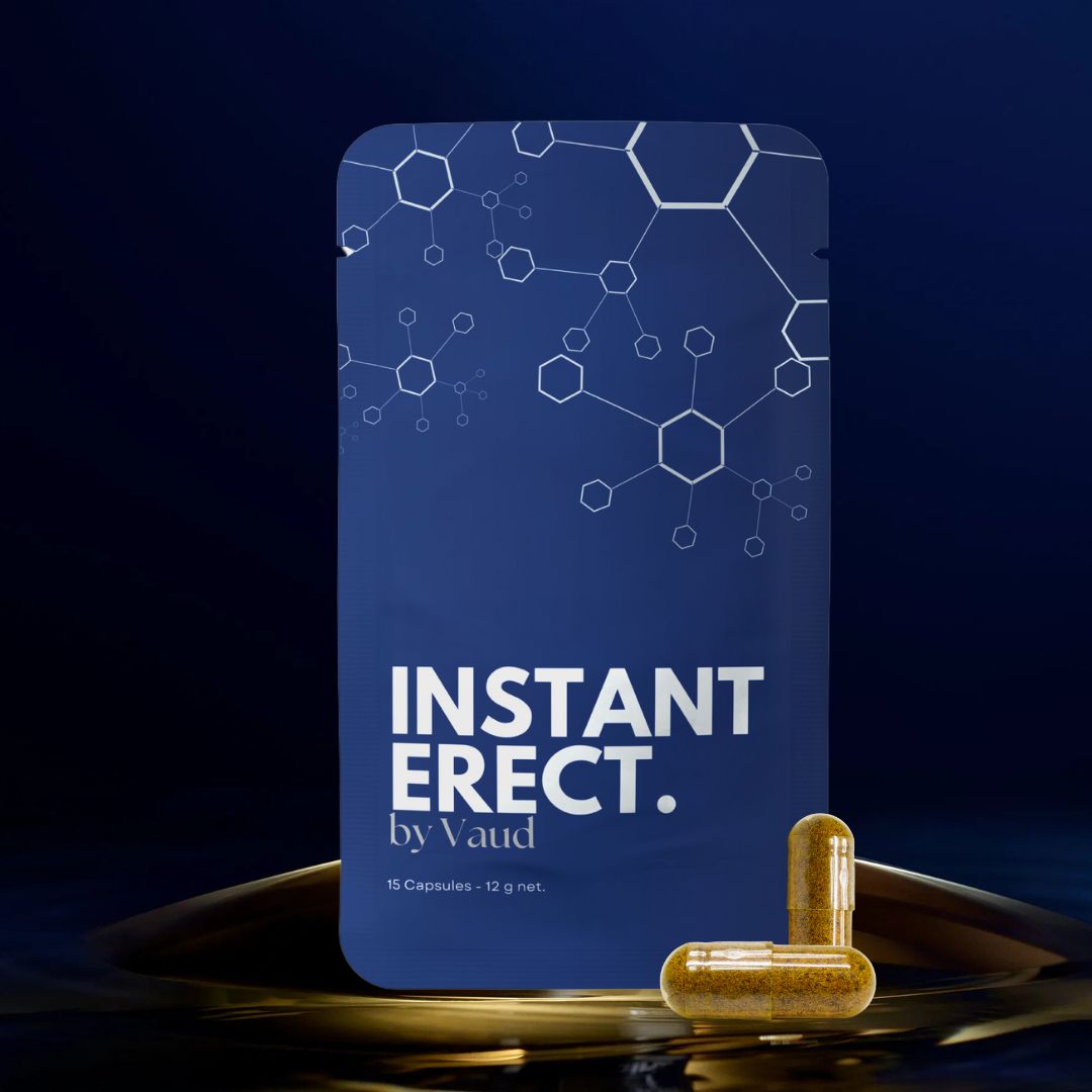 Blaue Verpackung mit weißer Schrift: INSTANT ERECT. by Vaud. 15 Kapseln - 12 g netto. Zwei Kapseln daneben.