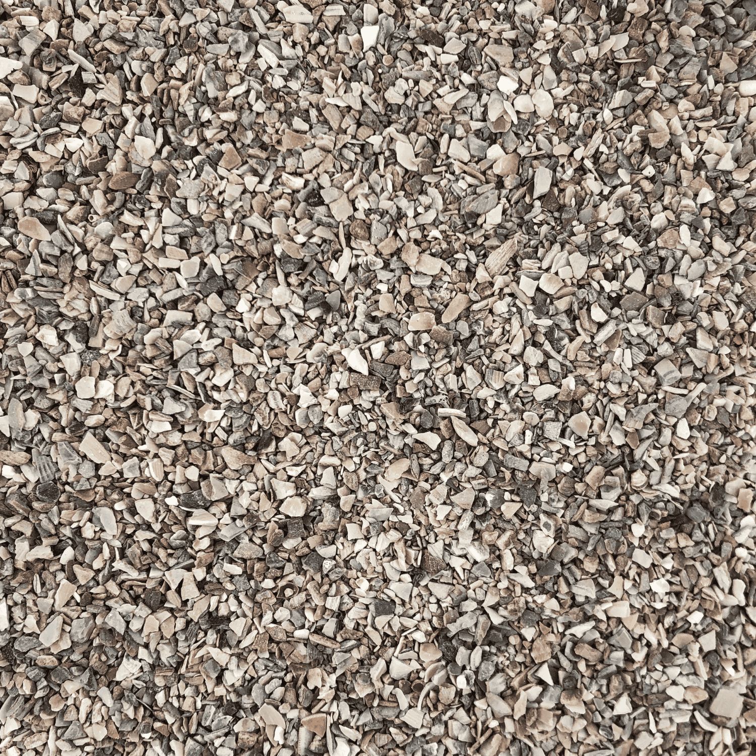 Nahaufnahme von Grit. Graue und beige Körnchen.