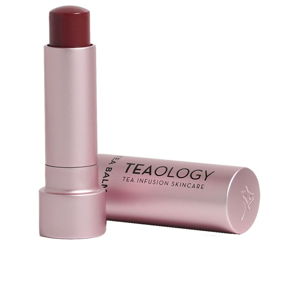 Lippenbalsam in rosa Hülse. Deckel daneben. Auf dem Deckel steht "TEA BALM" und "TEA INFUSION SKINCARE".