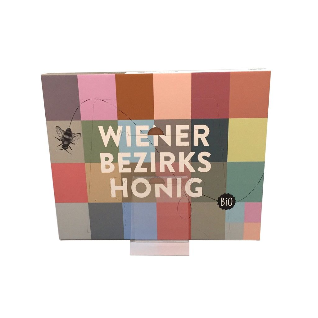 Adventskalender mit farbigem Design. Aufschrift: Wiener Bezirks Honig. Bio-Siegel. Bienen-Illustration.