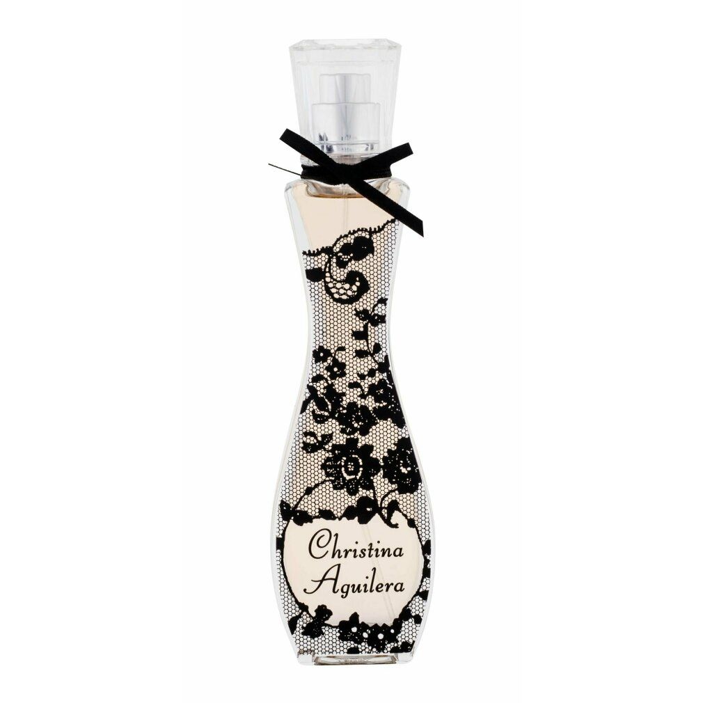 Flacone di profumo con motivo in pizzo nero e fiocco. Scritta: Christina Aguilera. Flacone trasparente.
