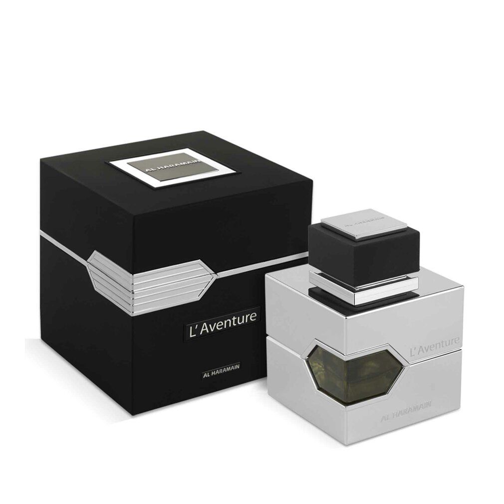 Silberfarbener Flakon und schwarze Verpackung. Aufschrift L'Aventure und Al Haramain. Flakon neben Box.