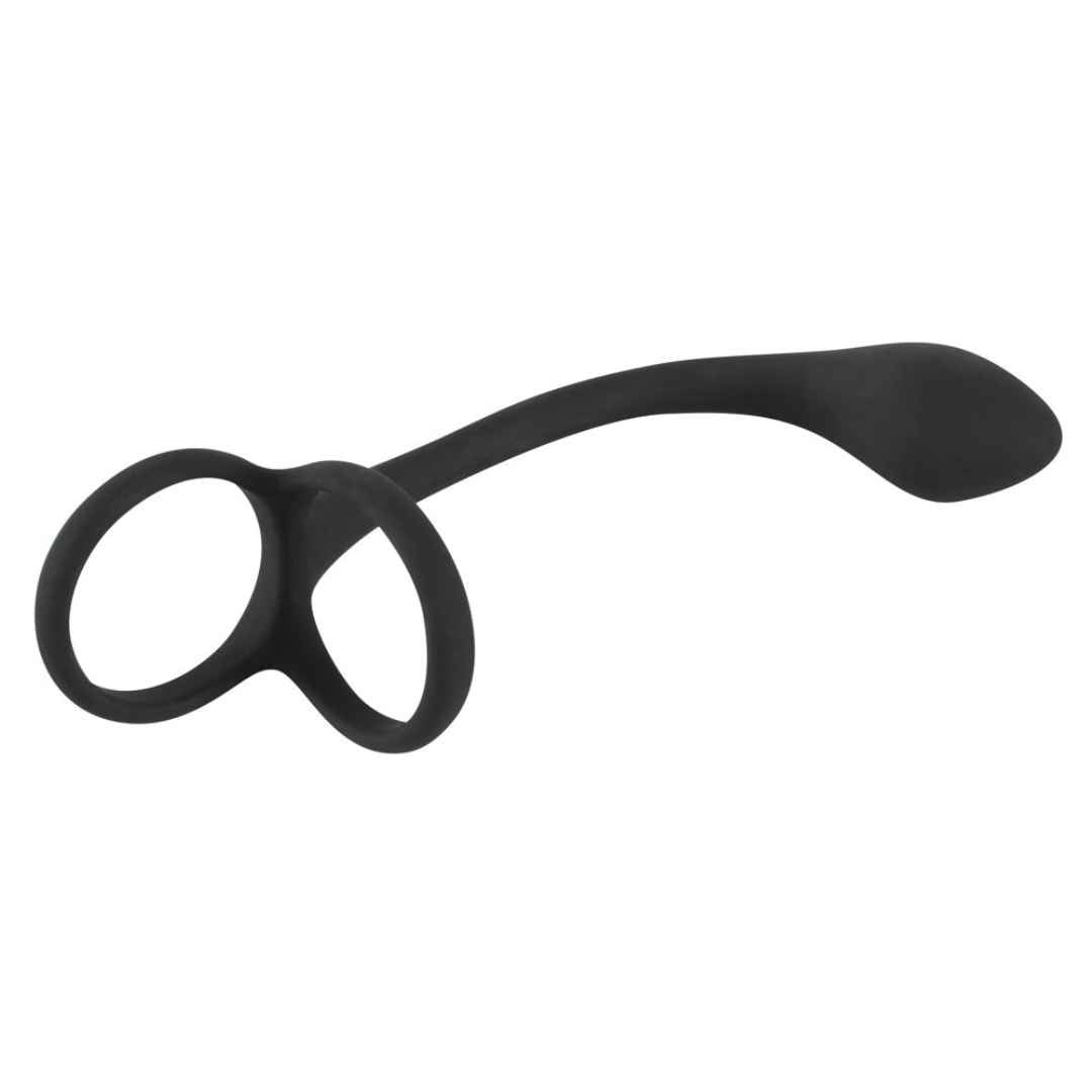 Schwarzer Penis-/Hodenring mit Analplug. Ringförmiger Teil mit zwei Öffnungen, verbunden mit einem gebogenen Stab und einem tropfenförmigen Ende.