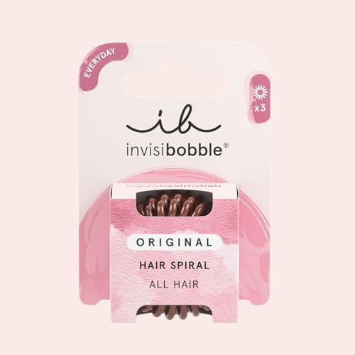 Verpackung mit braunen Haargummis in Spiralform. Marke: Invisibobble. Aufschrift: Original Hair Spiral.