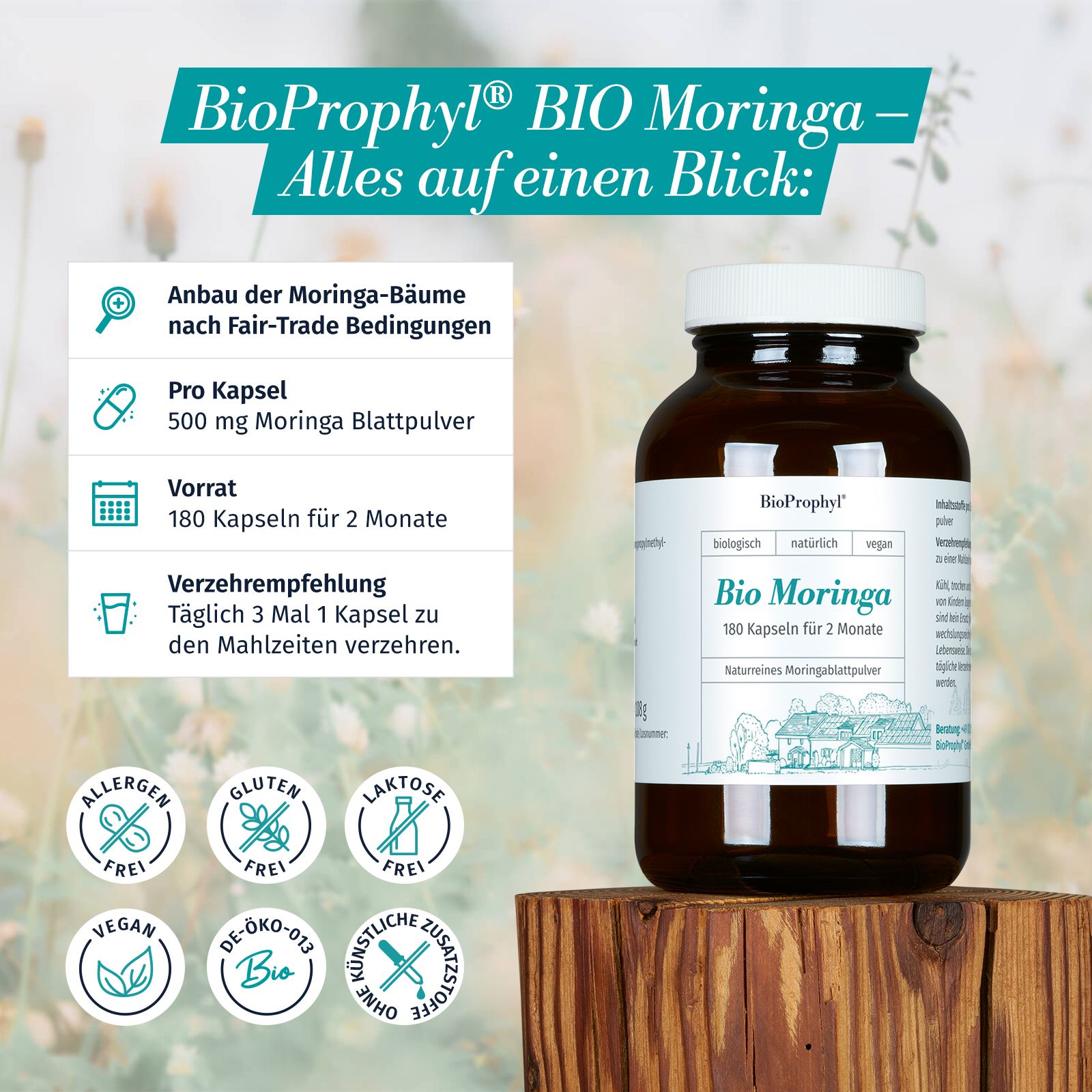 Braune Glasflasche mit weißem Deckel. BioProphyl Bio Moringa. 180 Kapseln. Aufschrift: vegan, allergenfrei, glutenfrei, laktosefrei. Auf Holzblock.