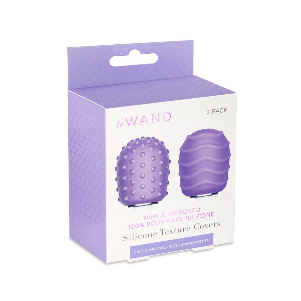 Verpackung mit zwei lilafarbenen Aufsätzen. Aufschrift: Le Wand, 2-Pack, NEW & IMPROVED, 100% BODY-SAFE SILICONE, Silicone Texture Covers.