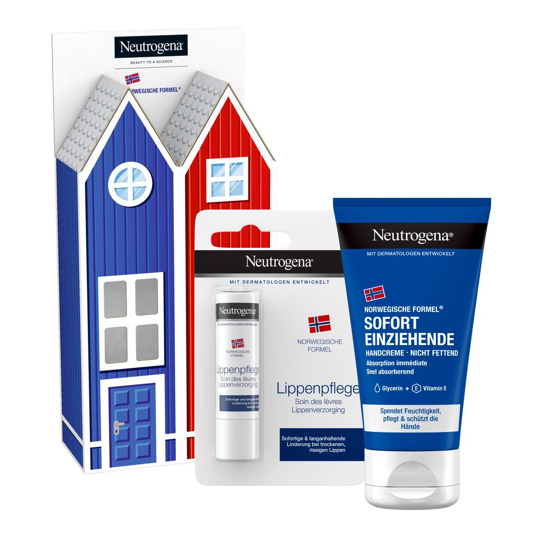 Geschenkset mit Handcreme und Lippenpflege. Handcreme-Tube und Lippenpflegestift neben einer Geschenkverpackung in Hausform.