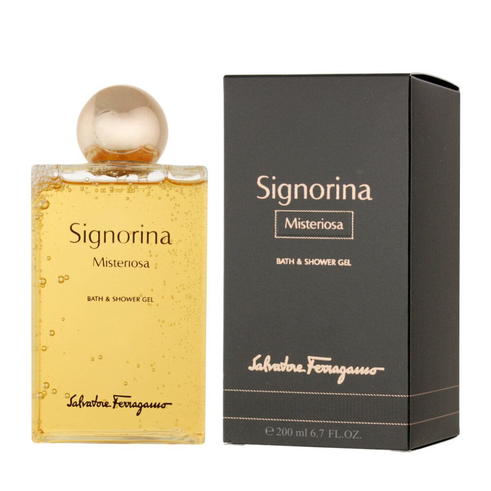 Produktflasche und Verpackung nebeneinander. Flasche mit goldfarbenem Deckel, gelbem Inhalt. Verpackung: schwarz, Text: Signorina Misteriosa, Bath & Shower Gel.
