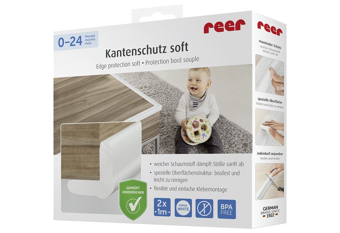 Verpackung mit weißem Kantenschutz soft. Text: 0-24, Kantenschutz soft, Edge protection soft, Protection bord souple. Baby im Hintergrund.