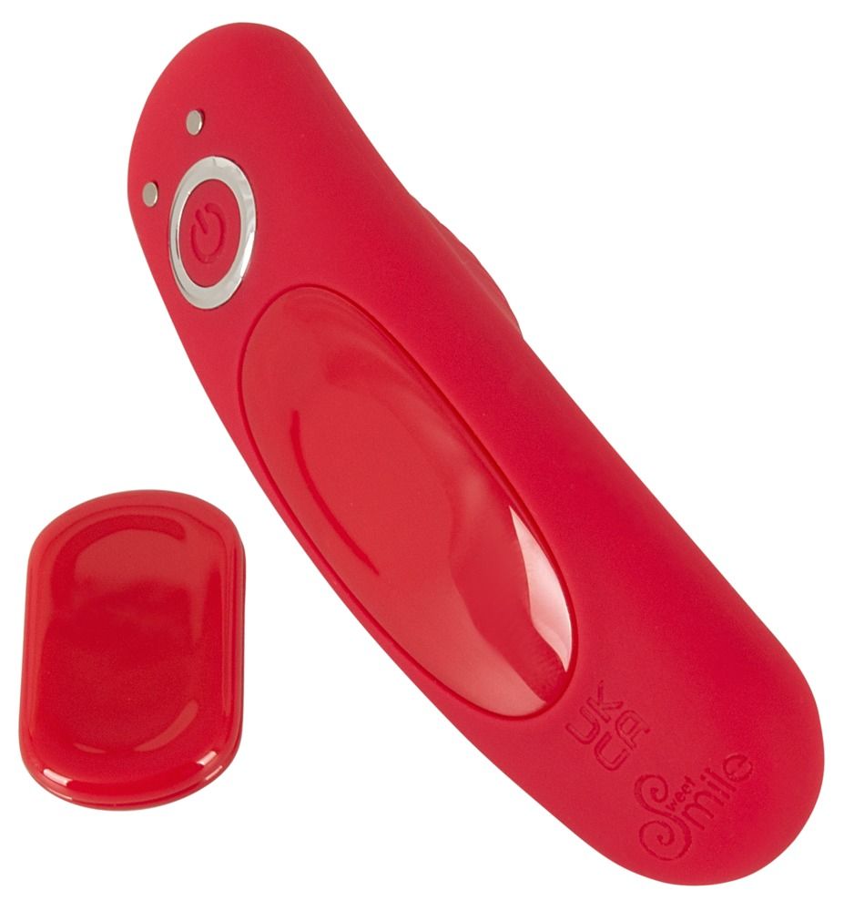 Roter Vibrator mit Fernbedienung und magnetischem Verschluss. Smile-Logo und UKCA-Zeichen. Zwei Teile.