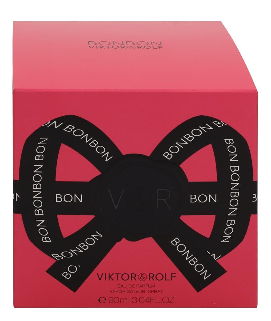 Rosa Verpackung mit schwarzem Schleifen-Design und Schriftzug BONBON. Marke Viktor & Rolf.