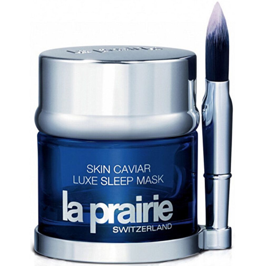 Blauer Tiegel mit silbernem Deckel und Pinsel. Aufschrift: Skin Caviar, La Prairie. Pinsel mit blauem Griff.