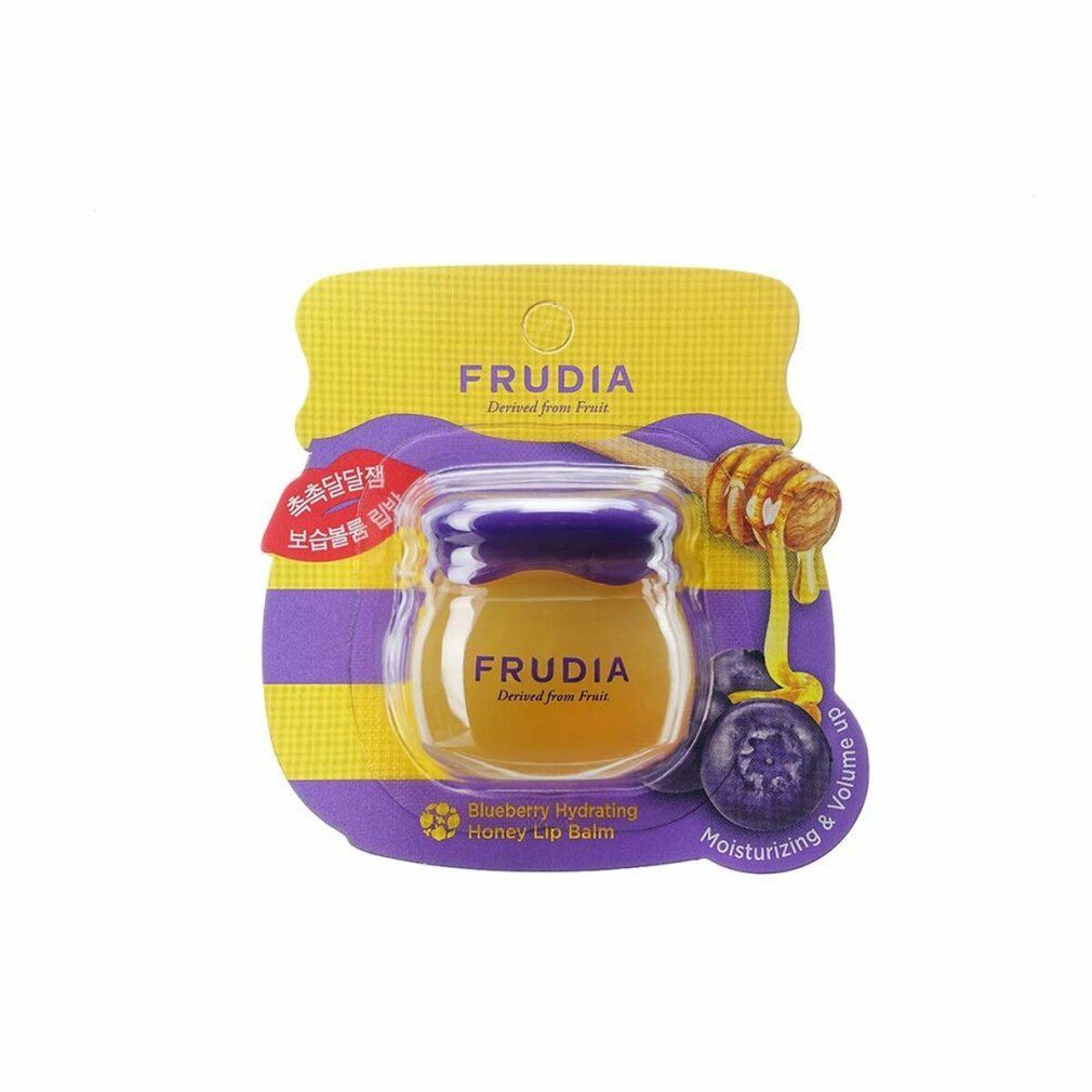 Verpackung mit Honig-Lippenbalsam. Aufschrift FRUDIA, darunter 'Blueberry Hydrating Honey Lip Balms'.
