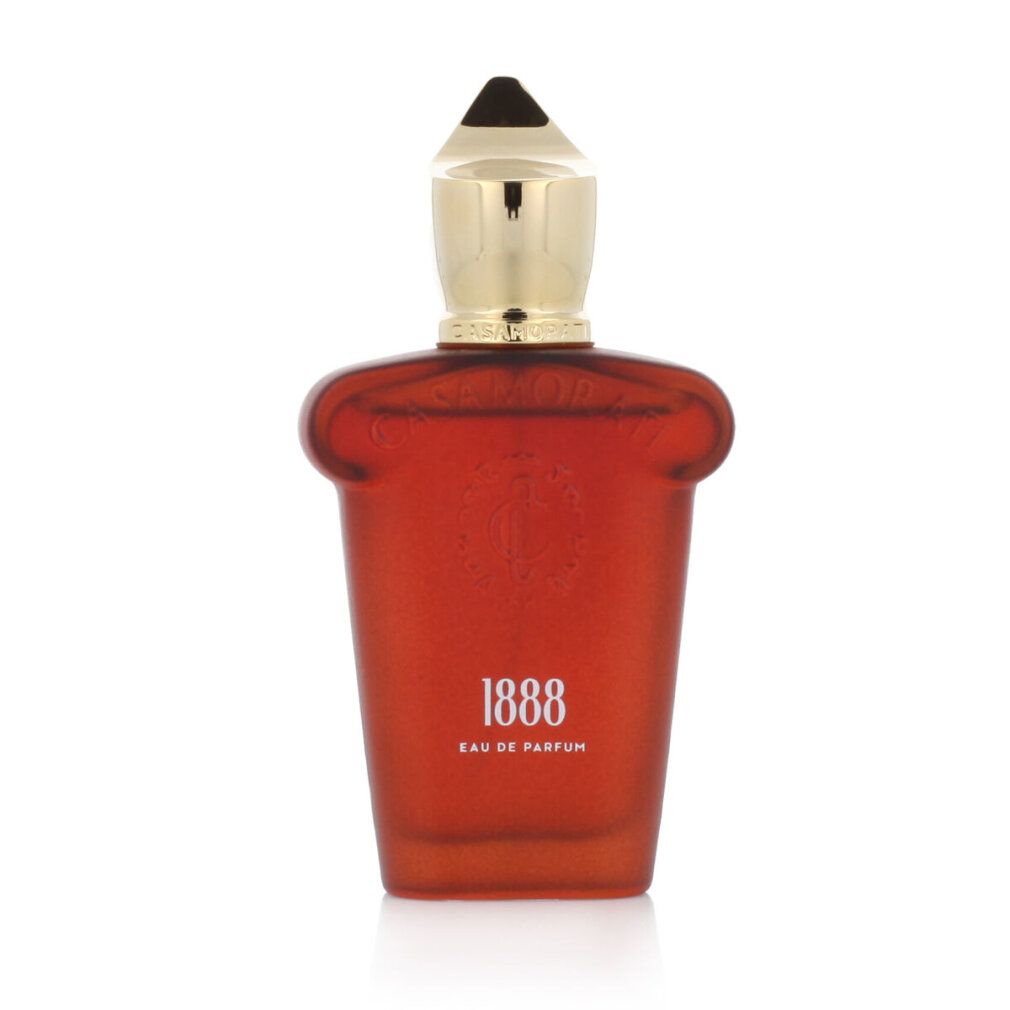 Roter Flakon mit goldfarbenem Verschluss. Aufschrift "1888 Eau de Parfum".