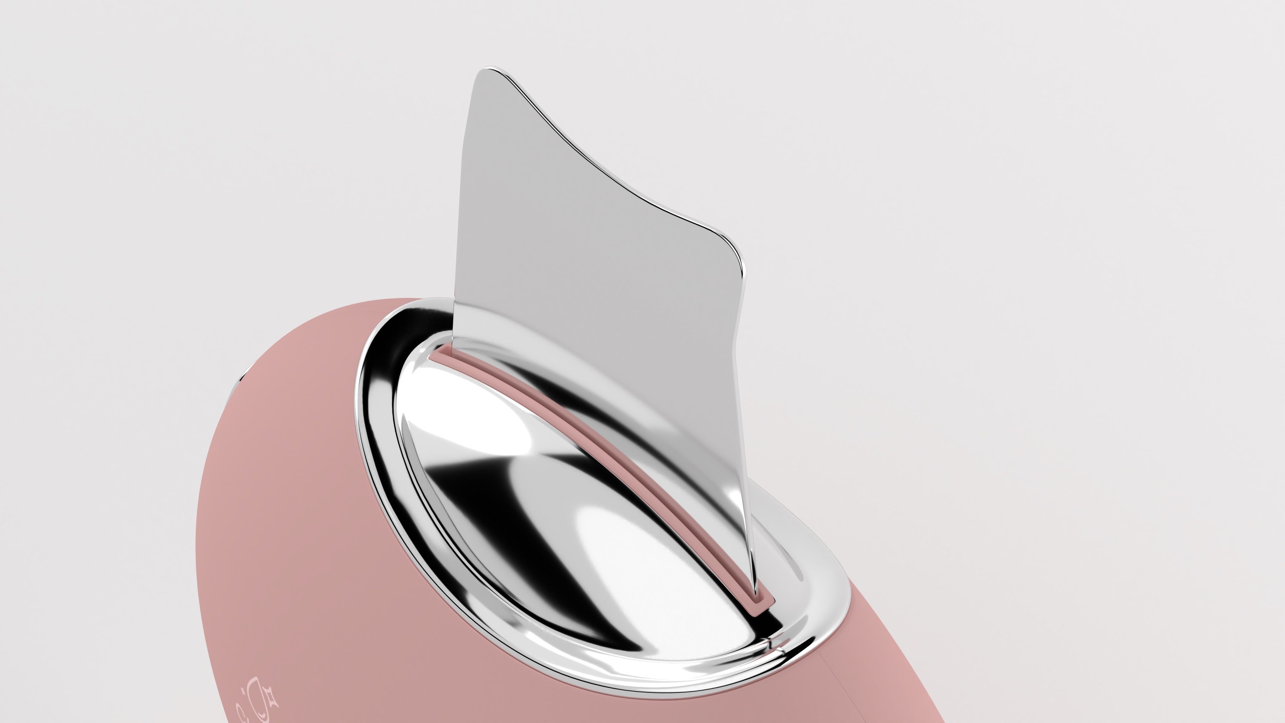 Nahaufnahme eines rosa Hautpeeling-Geräts mit Metallaufsatz. Der Aufsatz ist leicht angewinkelt.