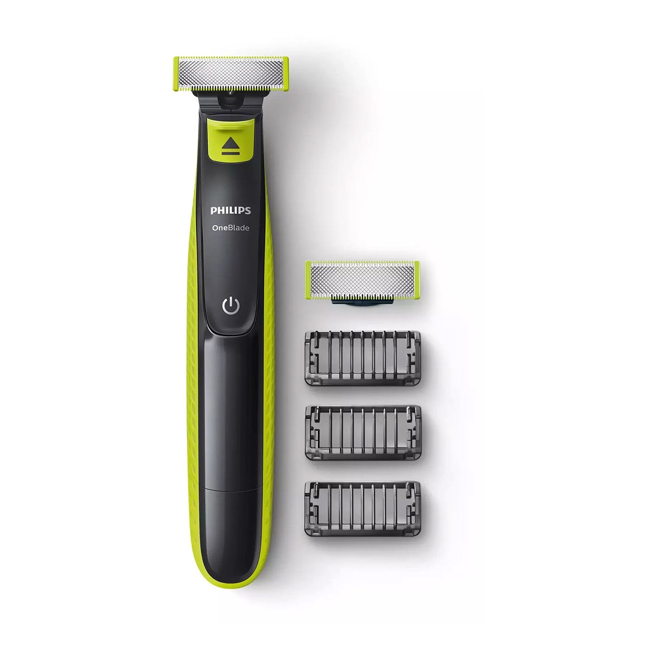 Barttrimmer mit drei Aufsätzen und Ersatzklingen. Der Trimmer ist schwarz und grün, mit silbernem Scherkopf. "Philips OneBlade".