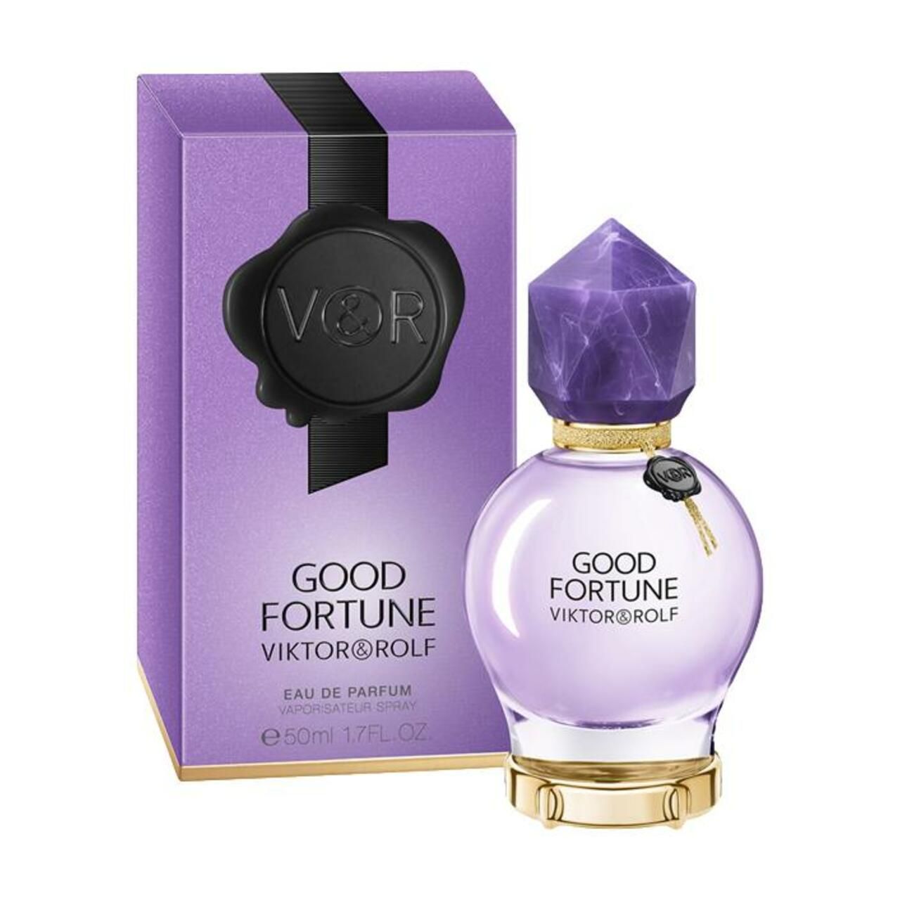 Violetter Karton und Flakon. Aufschrift: GOOD FORTUNE VIKTOR & ROLF. Flakon mit facettiertem Deckel. Schwarzes Siegel.