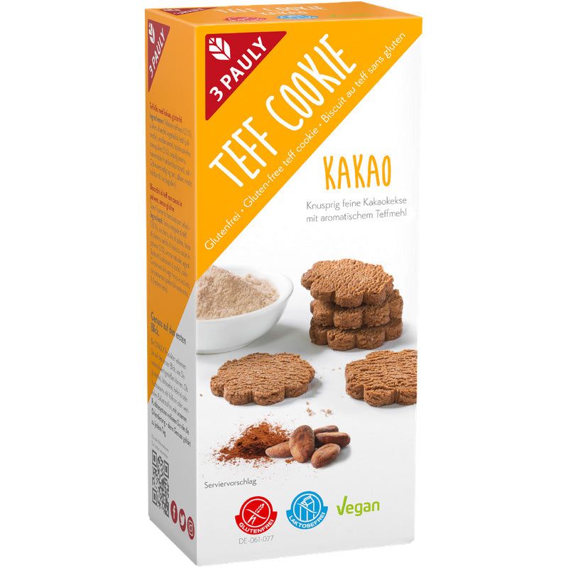 Verpackung mit Keksen. Aufschrift: 3 Pauly Teff Cookie Kakao glutenfrei. Vegan-Siegel.