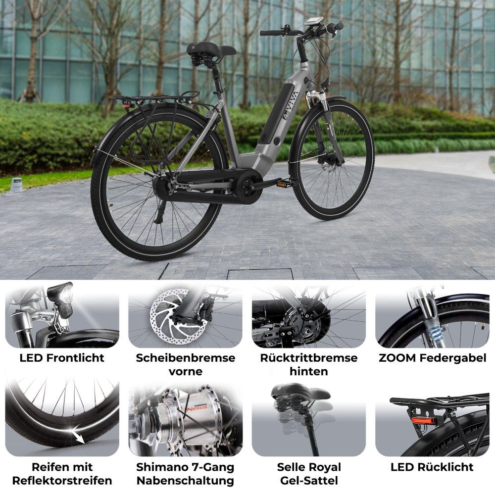 Silbernes E-Bike mit Details: LED-Licht, Scheibenbremse, Federgabel, Shimano-Schaltung.