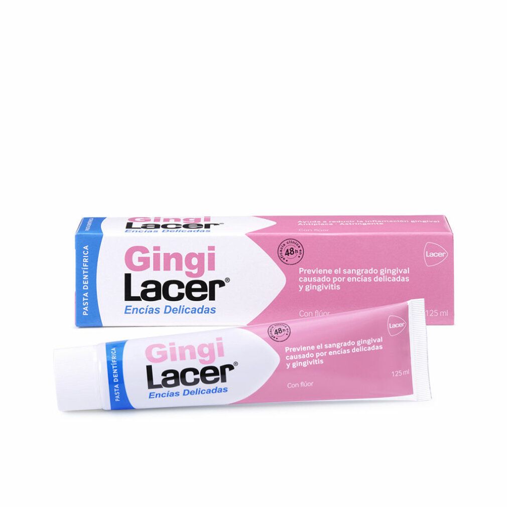 Zahnpasta-Tube und -Schachtel. Rosa und weiße Verpackung. Aufschrift: Gingi Lacer, Encias Delicadas. Enthält Fluorid.