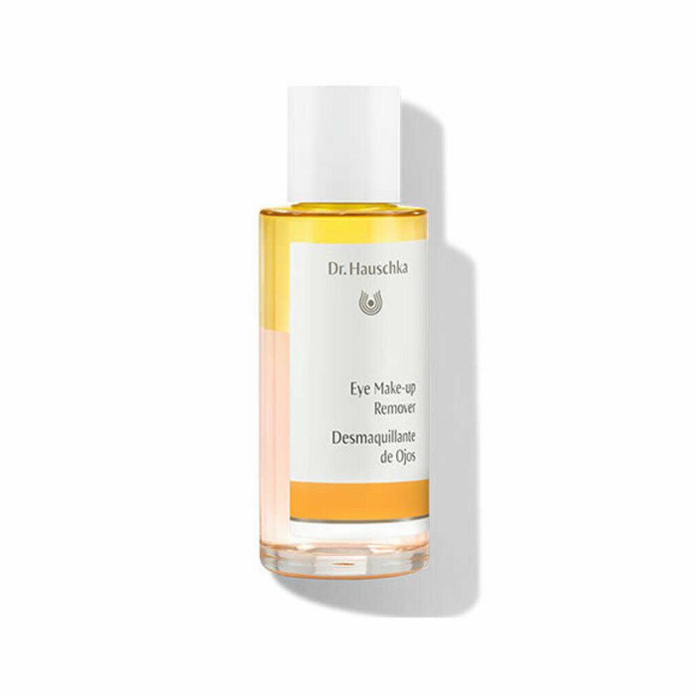 Transparente Flasche mit weißem Deckel. Etikett mit Produktbezeichnung und Logo. Gelber Streifen am unteren Rand. "Eye Make-up Remover".