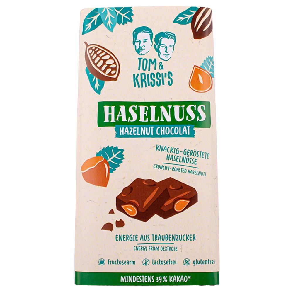 Schokoladentafel mit Haselnüssen. Aufschrift: Haselnuss, 39% Kakao. Abbildungen von Haselnüssen und Kakaobohnen.