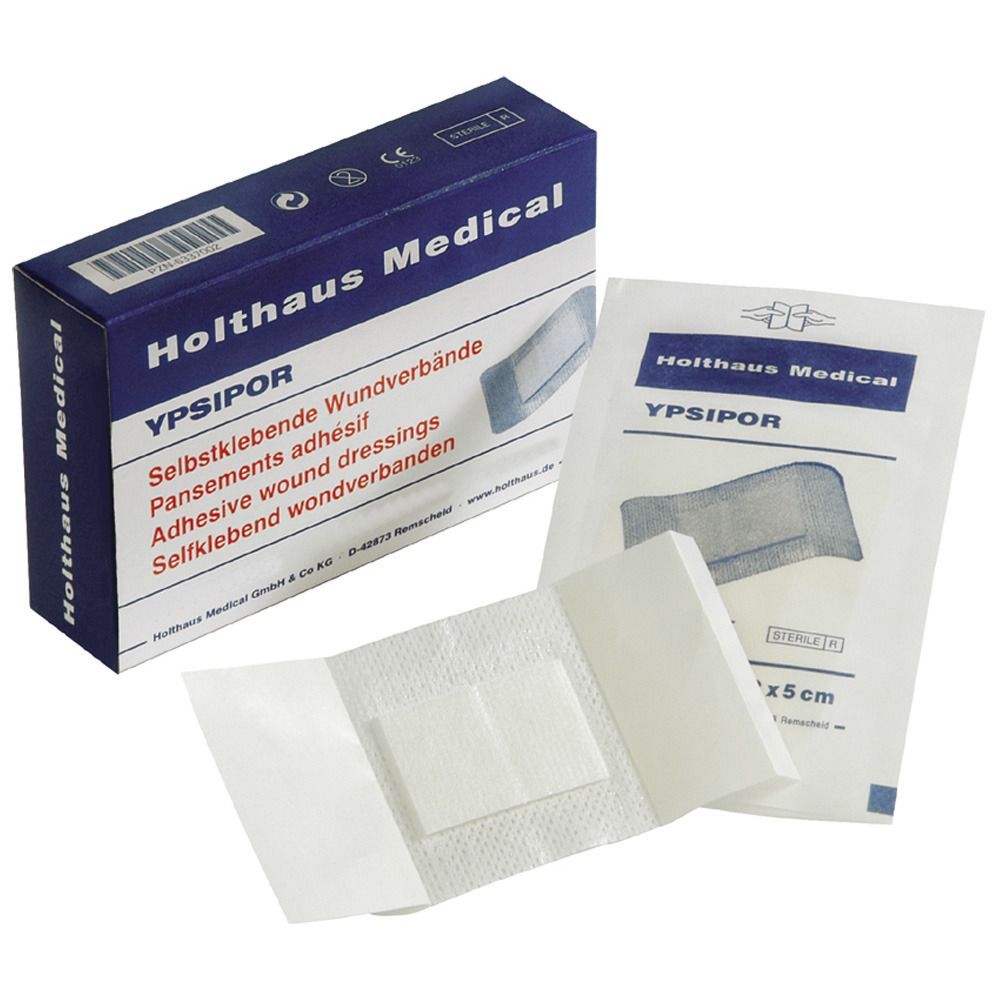 Verbandpackung und einzelne sterile Wundverbände. Größe: 7,2 x 5 cm. Marke: Holthaus Medical. Verpackung mit Produktinformationen.