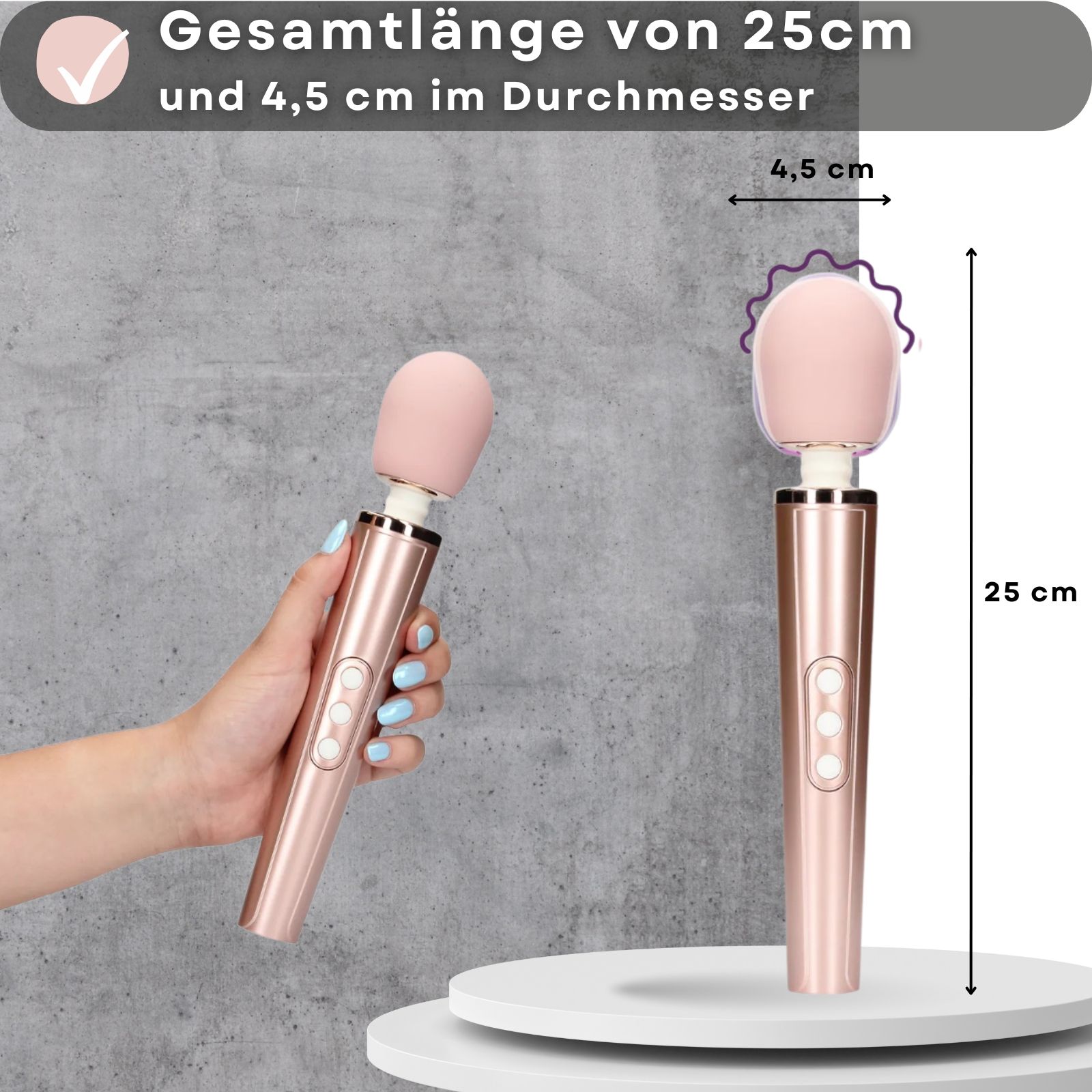 25 cm lang, 4,5 cm Durchmesser. Rosa Stabvibrator, goldfarbener Griff. Hand hält Produkt.