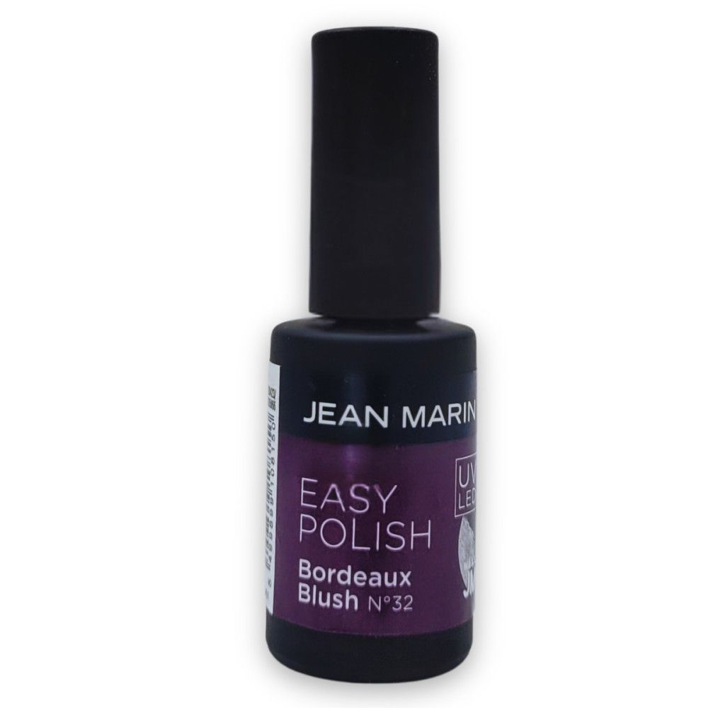 Flasche Nagellack, dunkelviolett. Aufschrift: Jean Marin, Easy Polish, Bordeaux Blush N°32. Schwarzer Deckel.