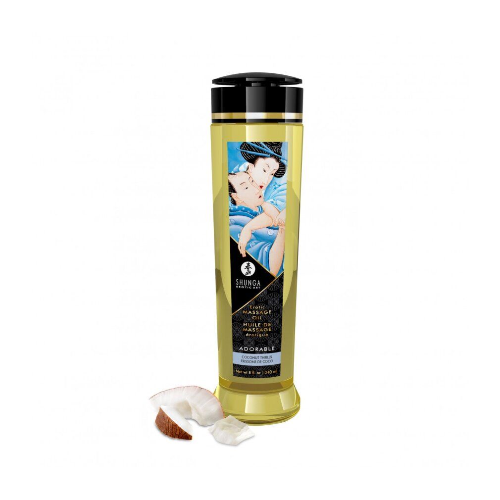 Zylindrische Flasche mit schwarzem Deckel. Etikett mit Abbildung und Text: Shunga, Erotic Massage Oil, Adorable. Kokosnuss daneben.