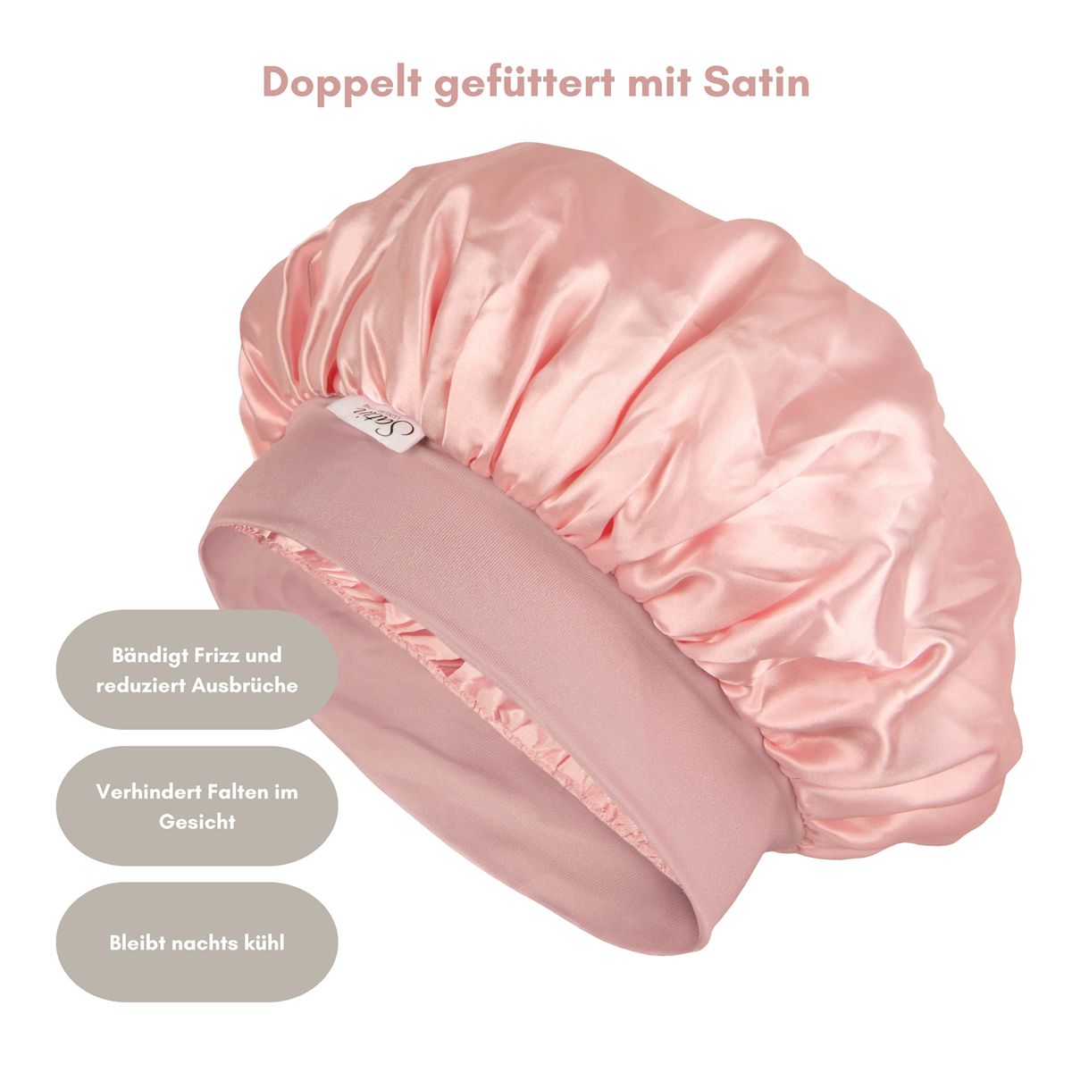 Een roze satijnen haarband. De haarband heeft een ronde vorm en is gemaakt van glanzende stof. Het is dubbel gevoerd met satijn.