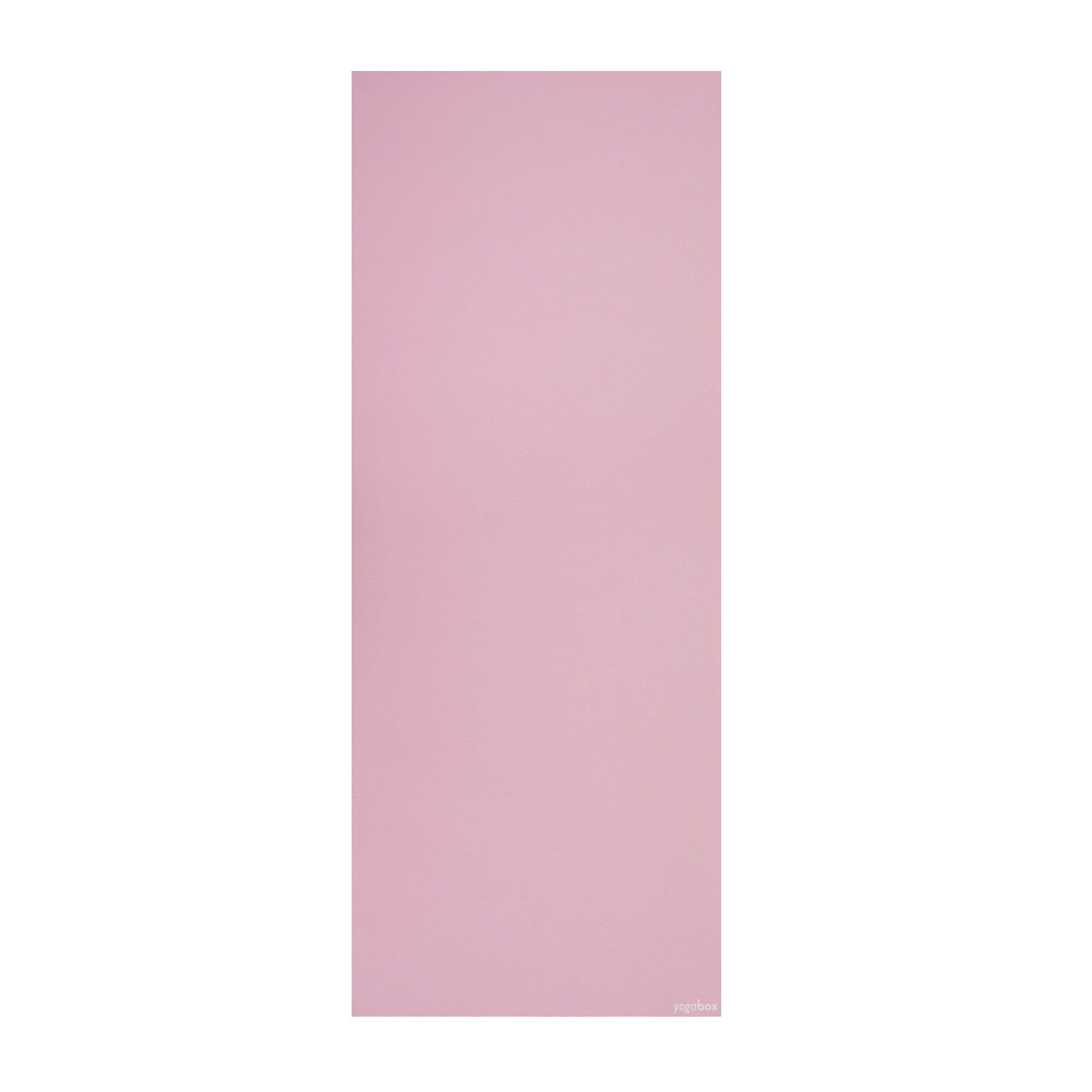 Entrollte rosa Yogamatte, flach liegend.