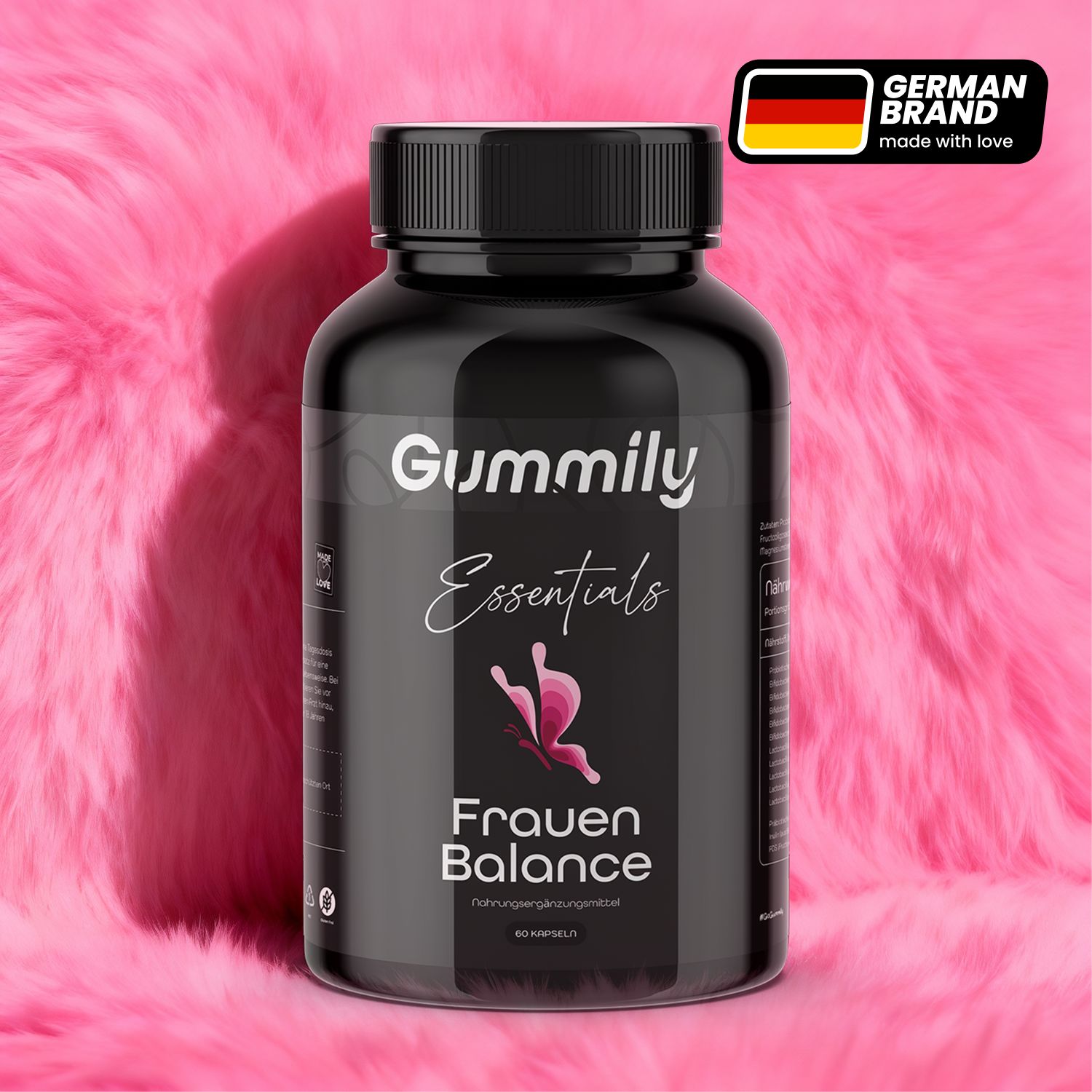 Schwarze Flasche mit Gummily Essentials Frauen Balance. Aufschrift und Logo. Deutsche Flagge und Schriftzug 'German Brand'.