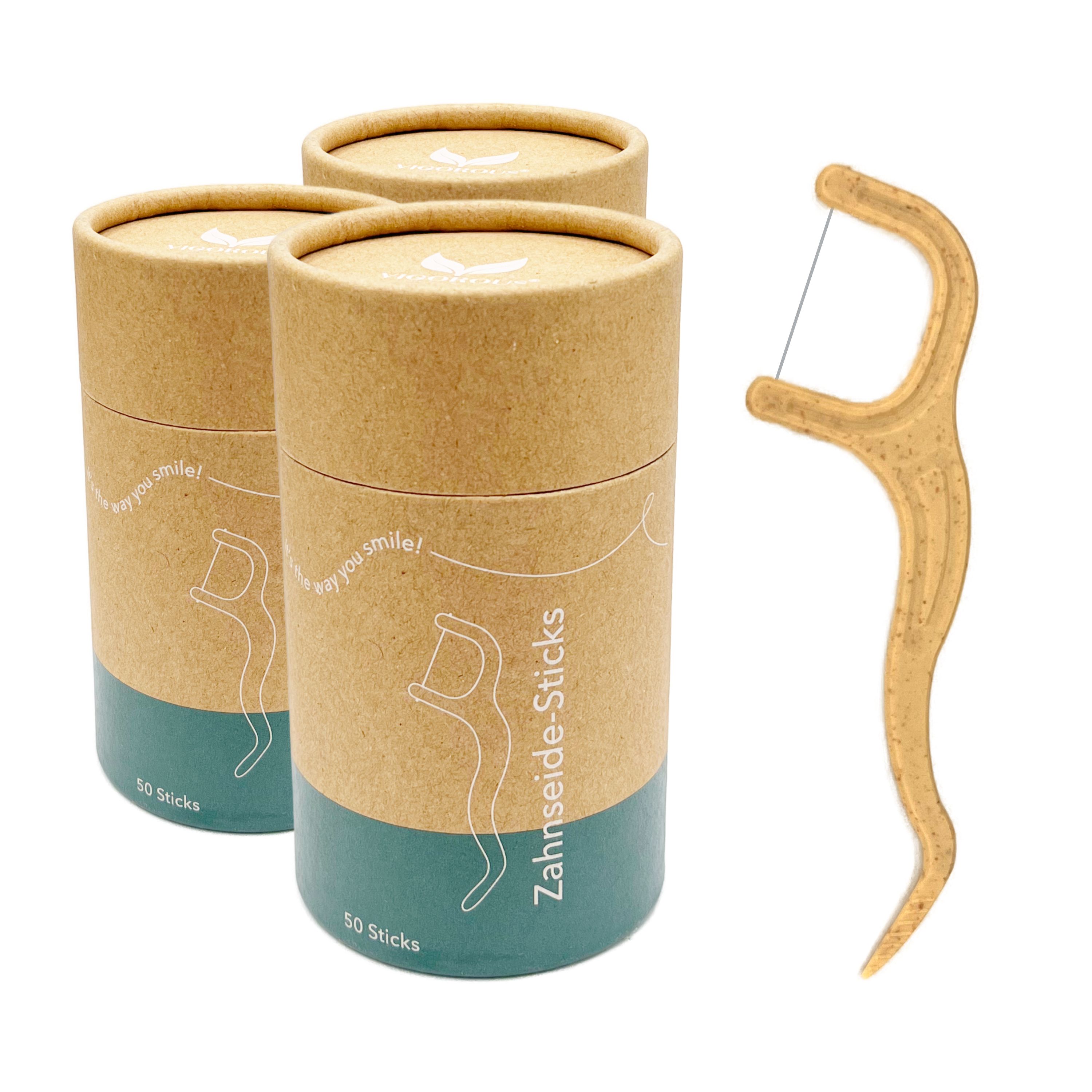 Drei zylindrische Behälter mit Zahnseide-Sticks und ein einzelner Stick. Aufschrift: 50 Sticks.