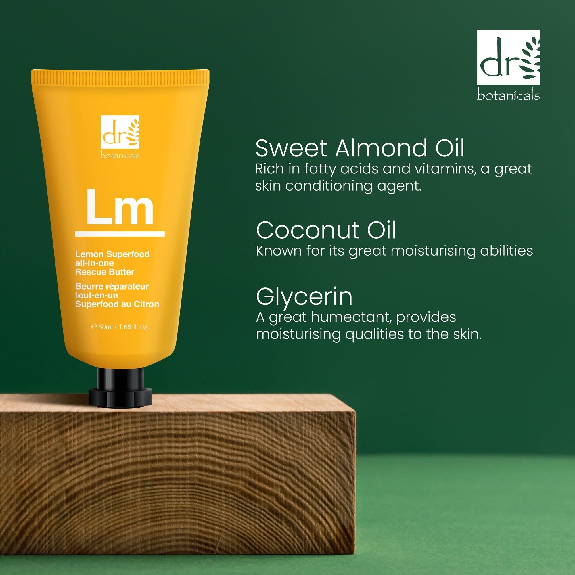 Gelbe Tube auf Holzblock. Aufschrift: Dr Botanicals, Lm Rescue Butter, Lemon Superfood. Text: Sweet Almond Oil, Coconut Oil, Glycerin.