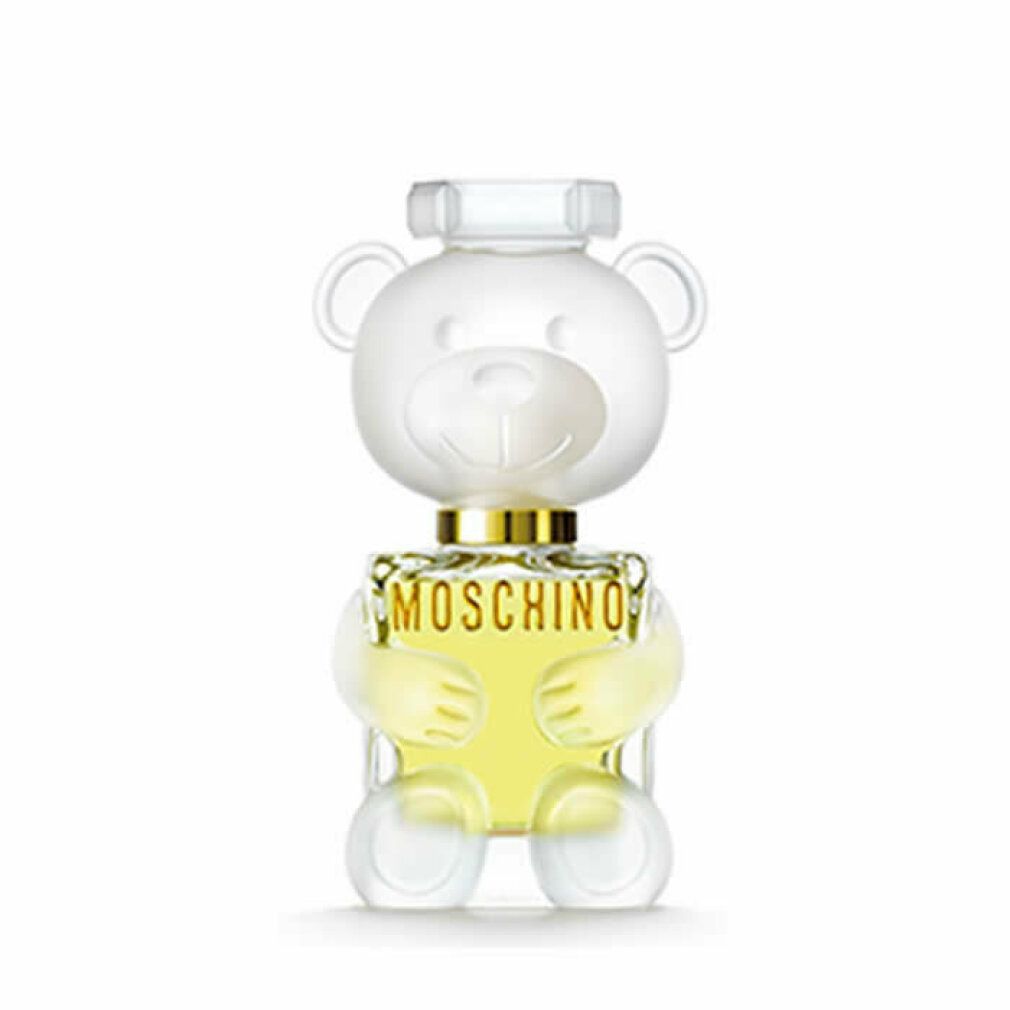 Parfümflakon in Teddybärform. Durchsichtiges Design mit goldfarbenem Halsband. Aufschrift: MOSCHINO.