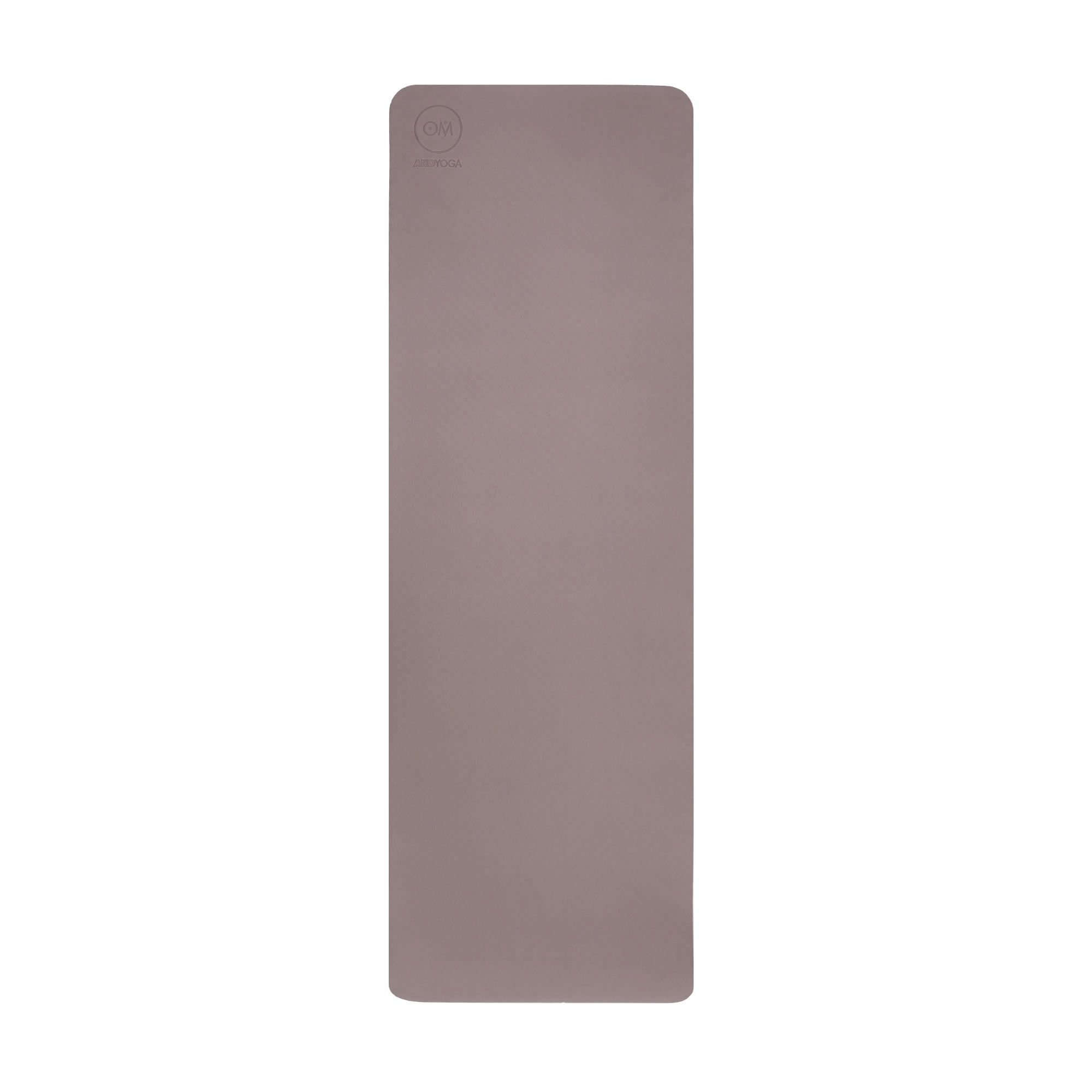 Ausgebreitete TPE-Yogamatte in Braun/Anthrazit mit Logo-Prägung oben links.