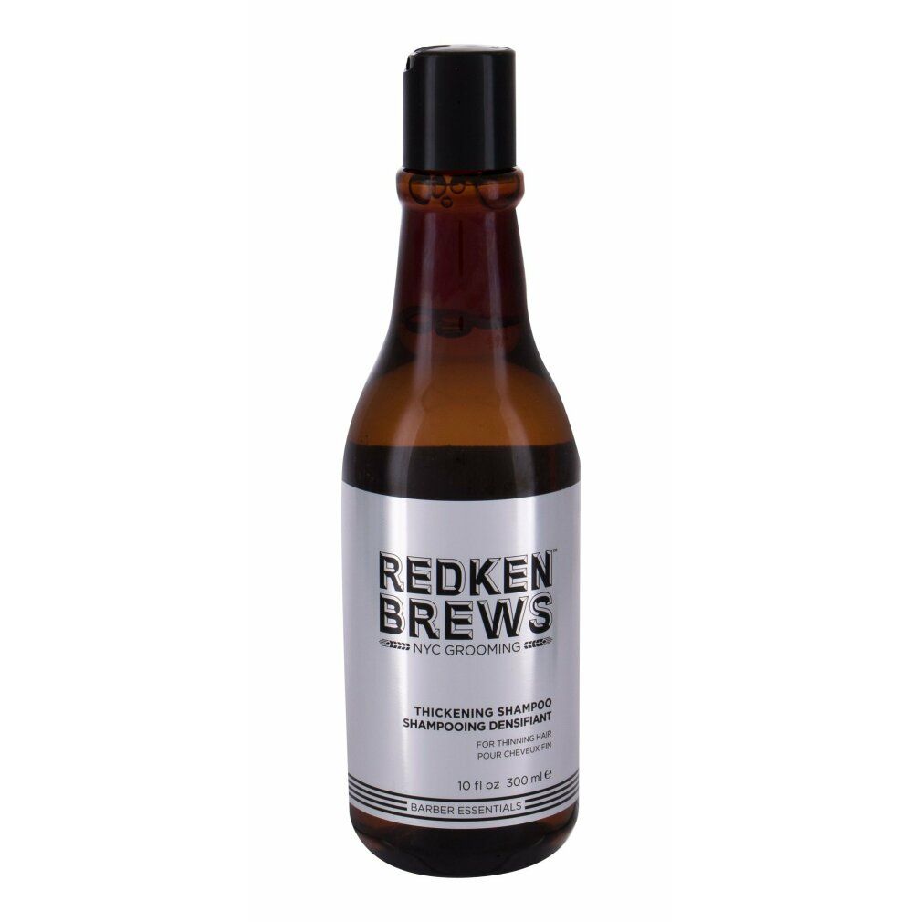Braune Flasche mit schwarzem Deckel. Silbernes Etikett mit Text: Redken Brews Thickening Shampoo. 10 fl oz.