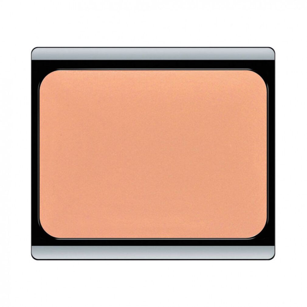 Hautfarbene Camouflage Creme in rechteckigem Behälter mit silbernem Rand und schwarzem Deckel.