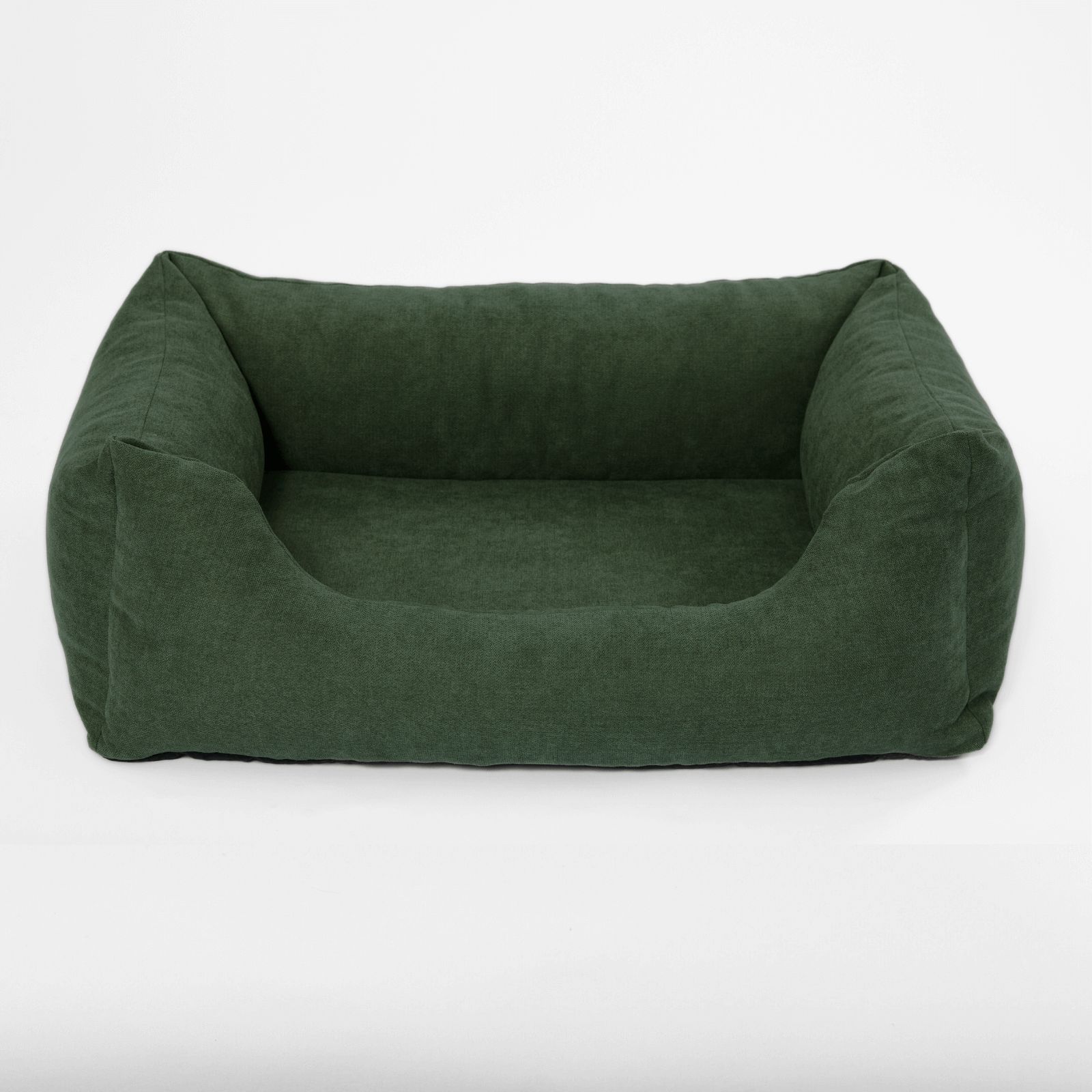 Grünes Hundebett mit erhöhten Seiten. Rechteckige Form. Stoffbezug.