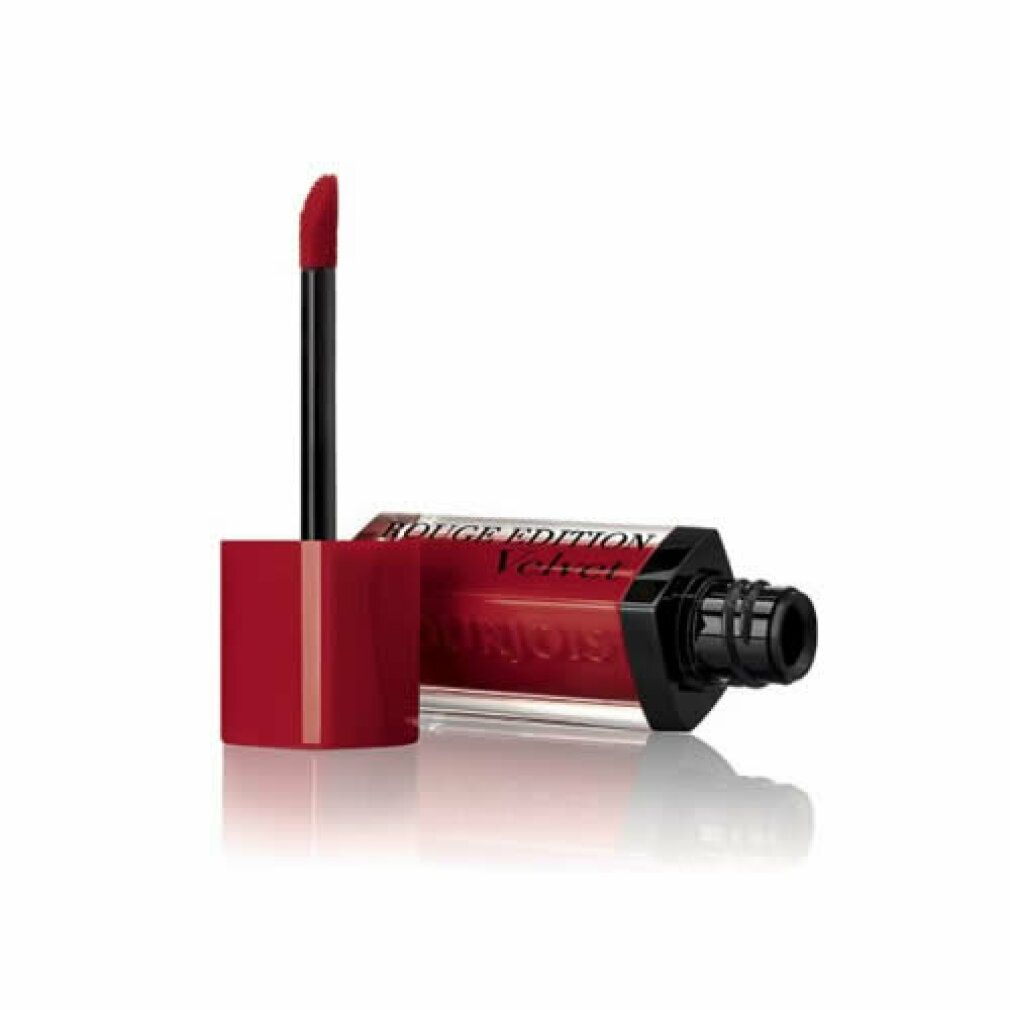 Roter Lippenstift mit Applikator. Flasche liegt. Schwarzer Applikator. Aufschrift: Rouge Edition Velvet.