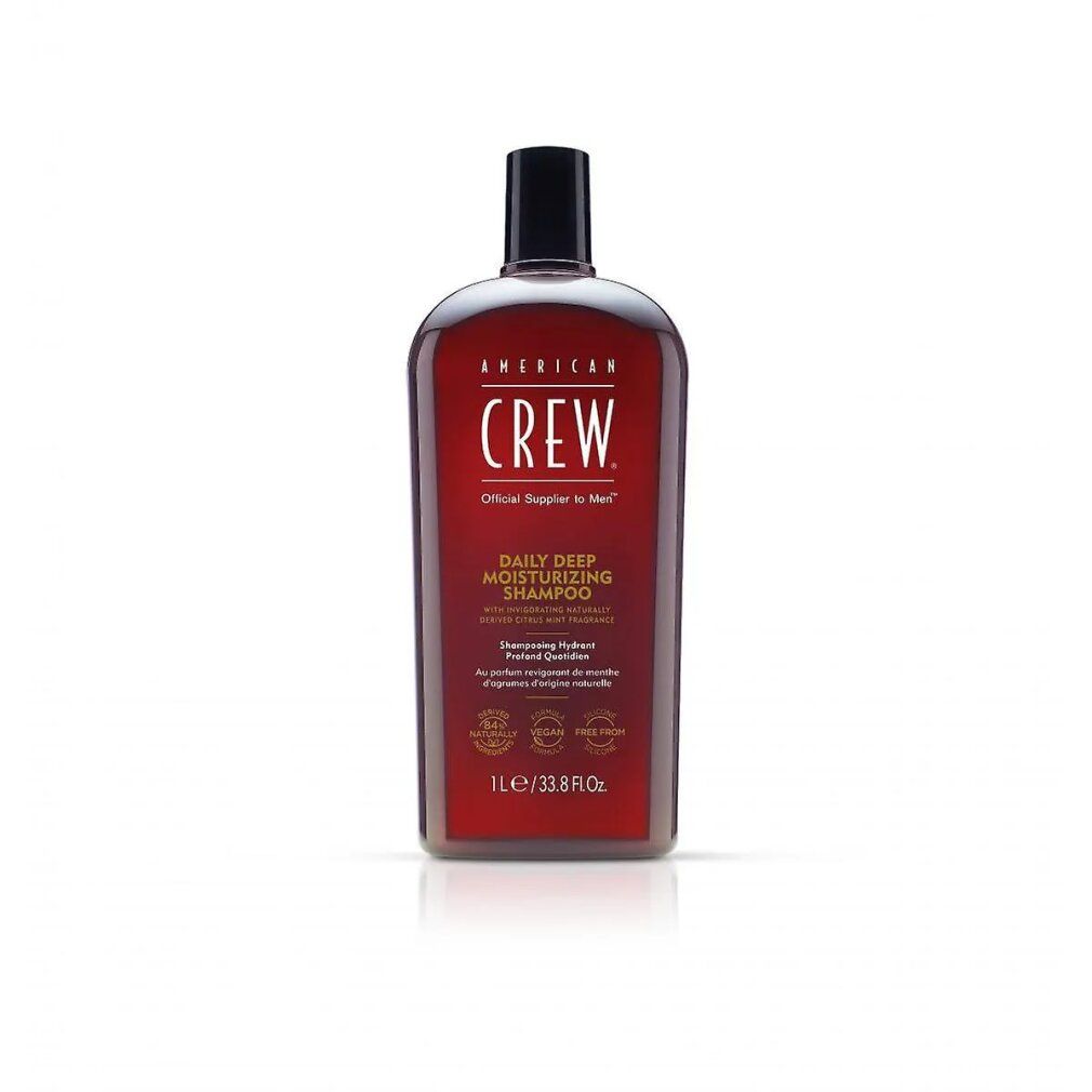Rote Flasche American Crew Shampoo. Schwarzer Deckel. Text: Daily Deep Moisturizing Shampoo. 1L/33.8 fl oz.